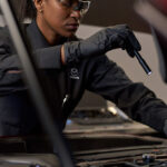 Mazda service technician prepping a car for winter