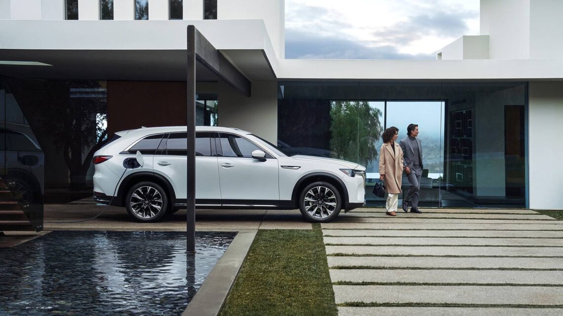 A Mazda PHEV charging in the driveway