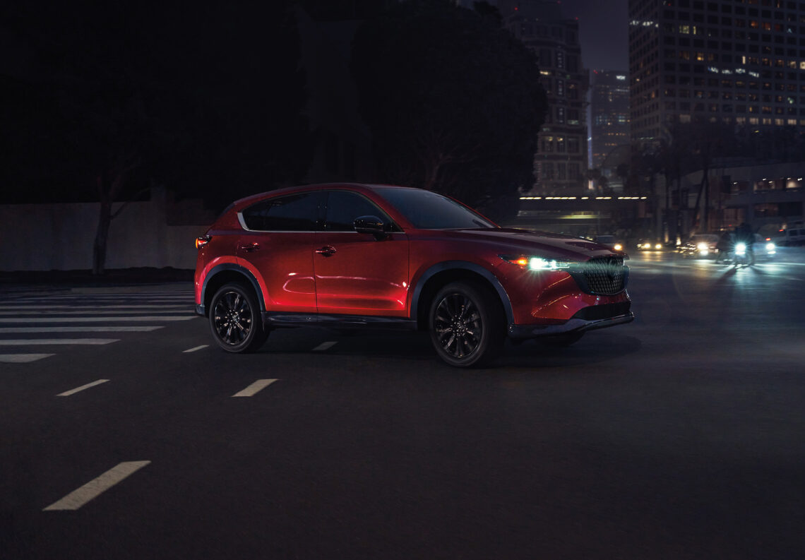 A parked new Mazda SUV at night
