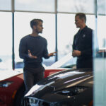 Customer speaking with salesperson at a Mazda dealership